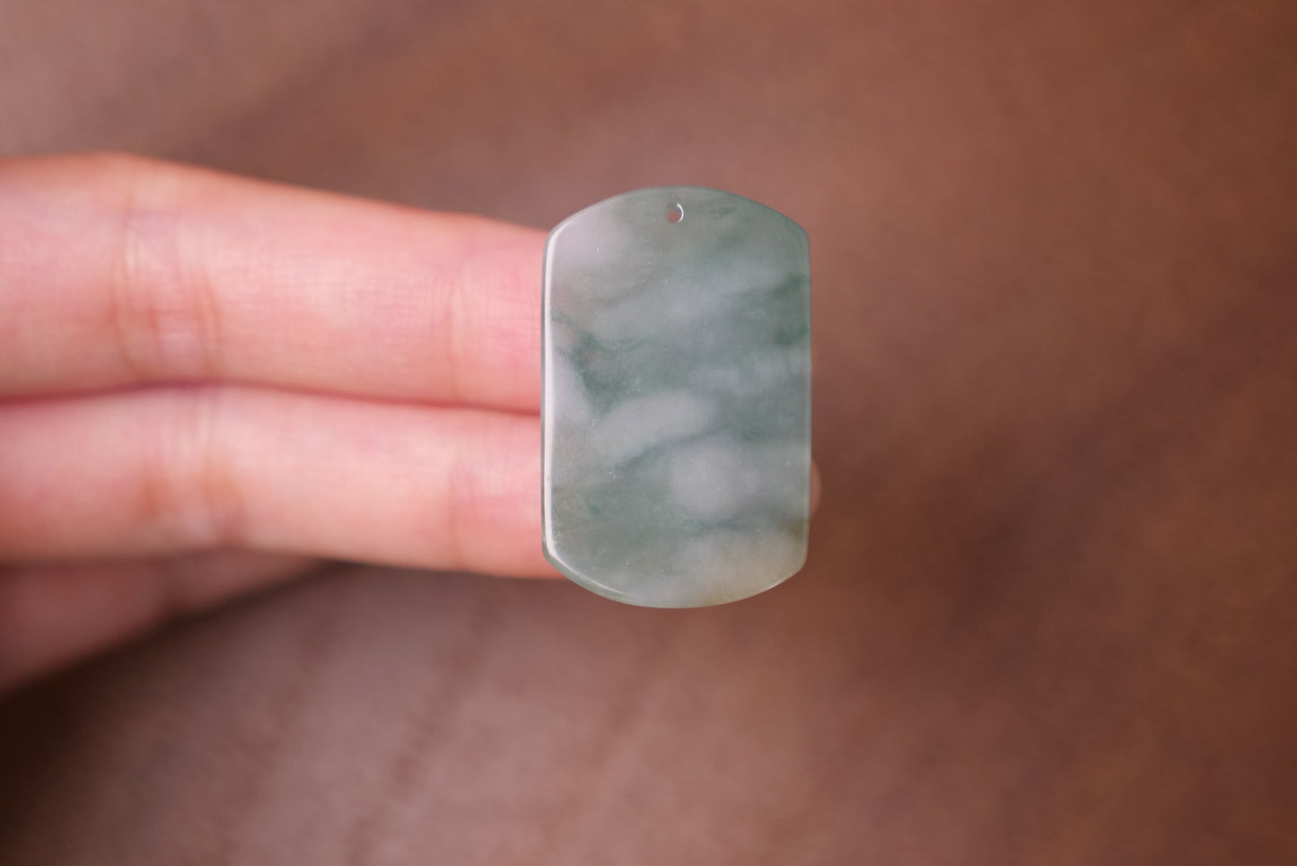 Floral and Geometric Design: Elegant Jade Pendant