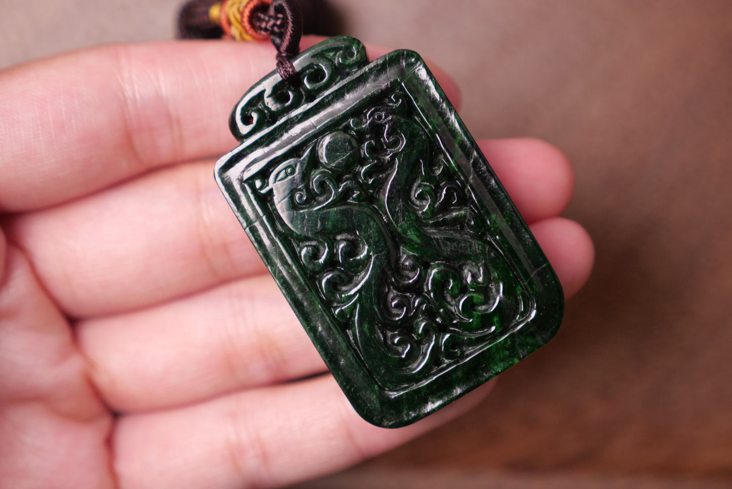 Dark Green Jade Pendant: Hand-Carved Dragon and Phoenix Design