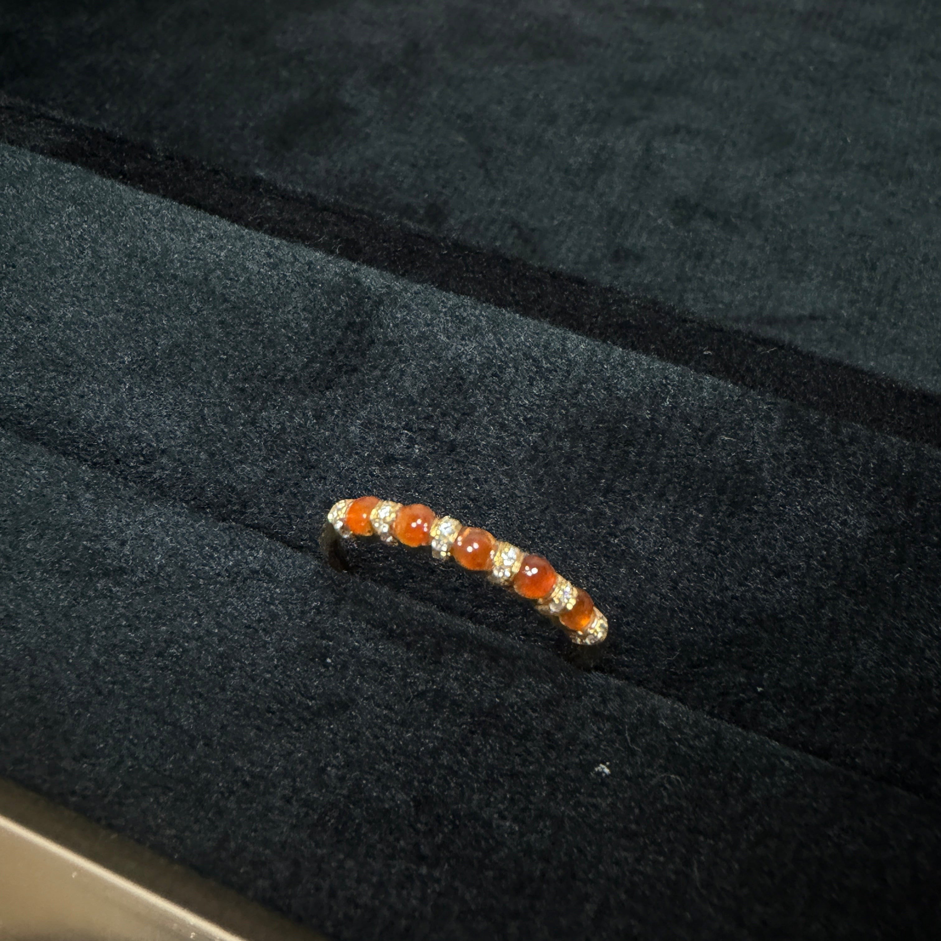 Sylvia Jewelry 18K gold ring with oval orange jadeite cabochons and small diamonds, perfect for stacking.